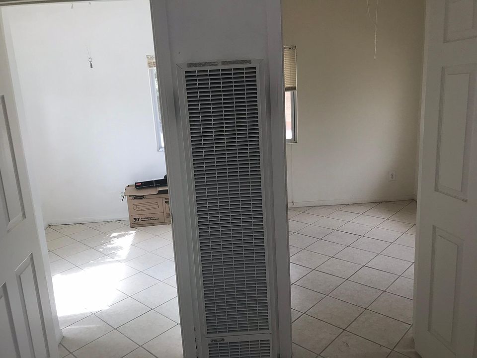 Wall furnace between two rooms.
