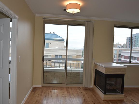 Dining area with Juliet balcony. Gas fire place dividing room . Plenty of light.