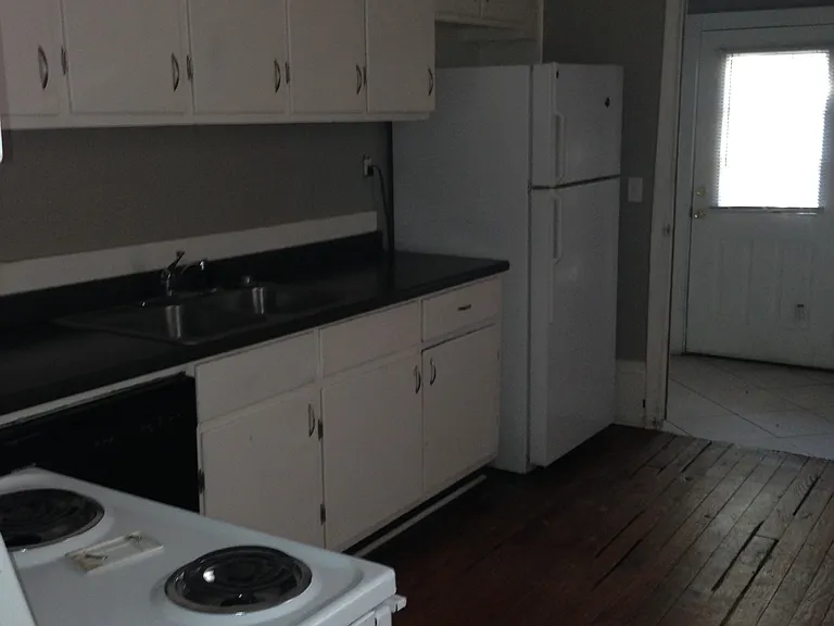 Tons of cabinets - cabinets go to ceiling. Back door leads to back yard.