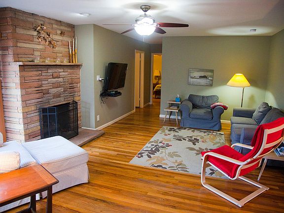 Living room and hall leading to 2 bedrooms and bath