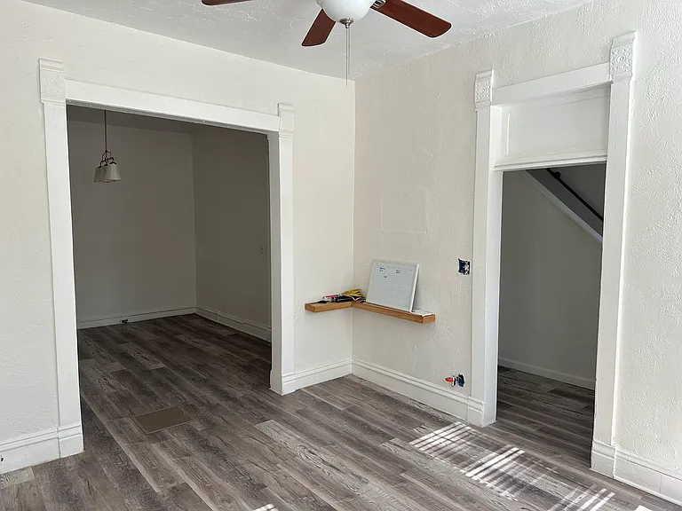 Living room looking at dining room and hallway