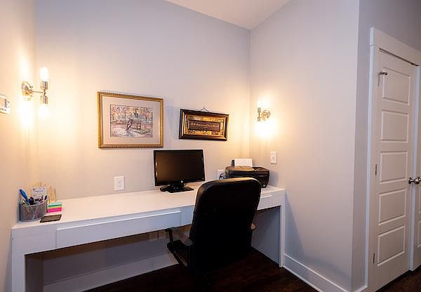 dedicated workspace with second screen, printer and office chair on 3rd floor
