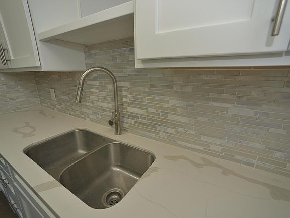 Brand new kitchen, with soft close drawers and cupboards. Quartz counters.