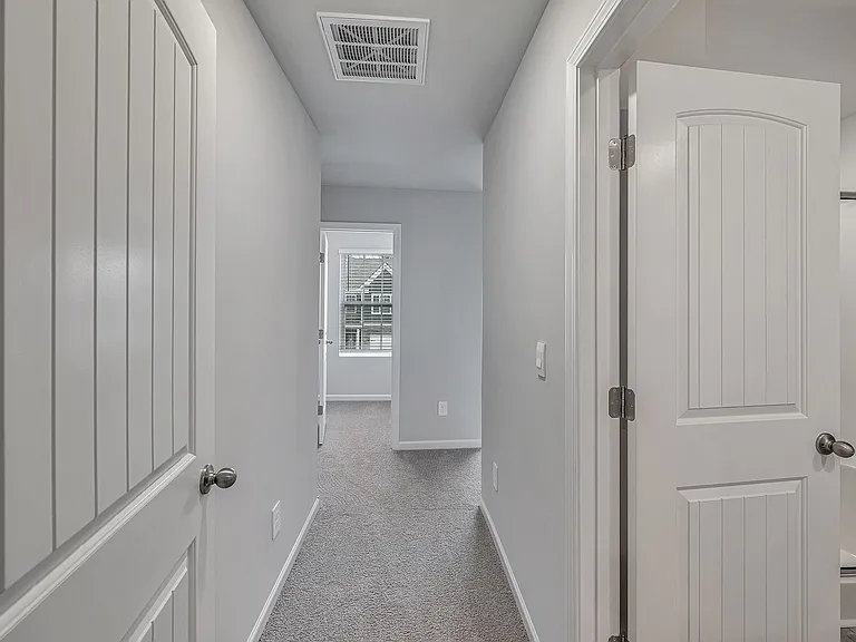 The 2nd-floor primary suite, with a large bathroom and walk-in closet, has a dedicated entry for maximum privacy.