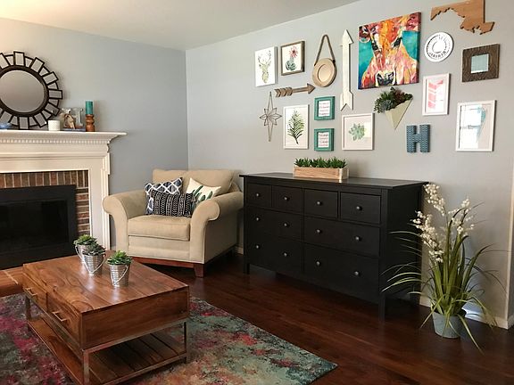 Front room with fireplace and hardwood floors (dimmable recess lights and wood feature above fireplace was added after this photo was taken)