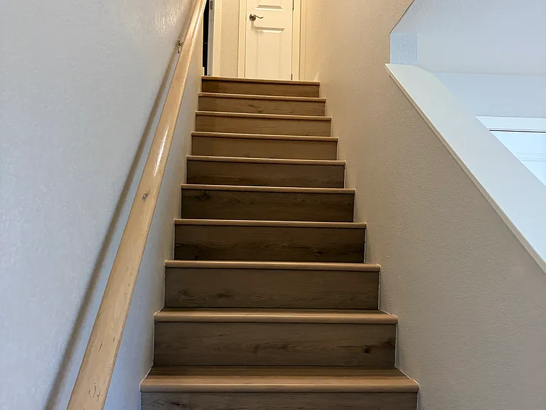 Stairs to second floor where you'll find two more bedrooms (each with it's own nook with lighting)