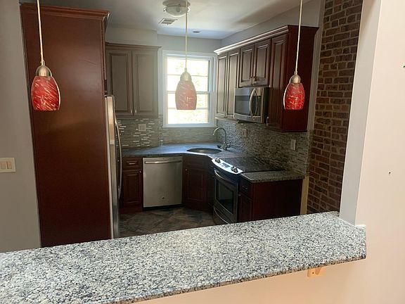 Kitchen - exposed brick and pass through to the living room