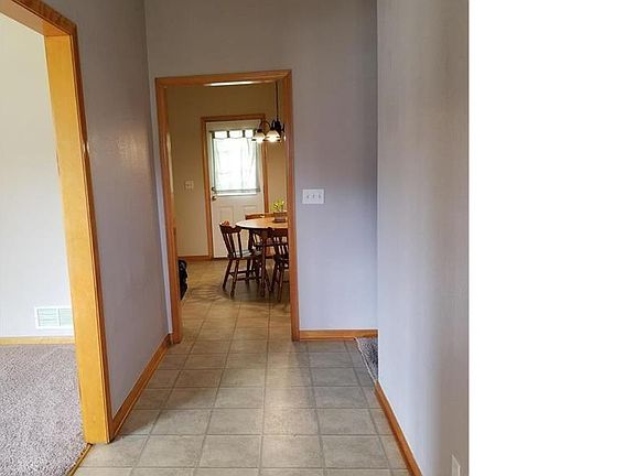 Big entry with living room on left and large eat in kitchen