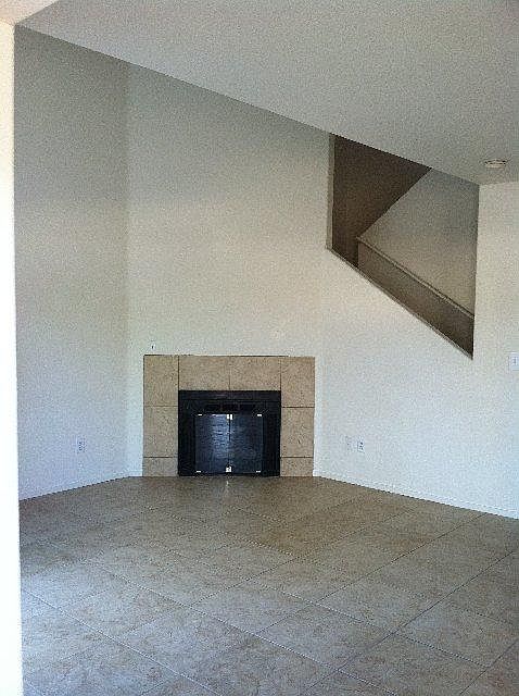 Fireplace in LR. Tile floors downstairs. 