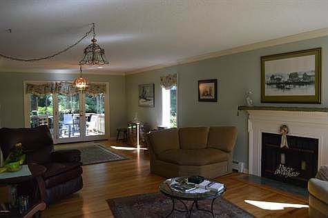 living/dining w hardwood and fireplace