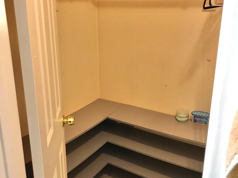 closet in master bedroom private bathroom