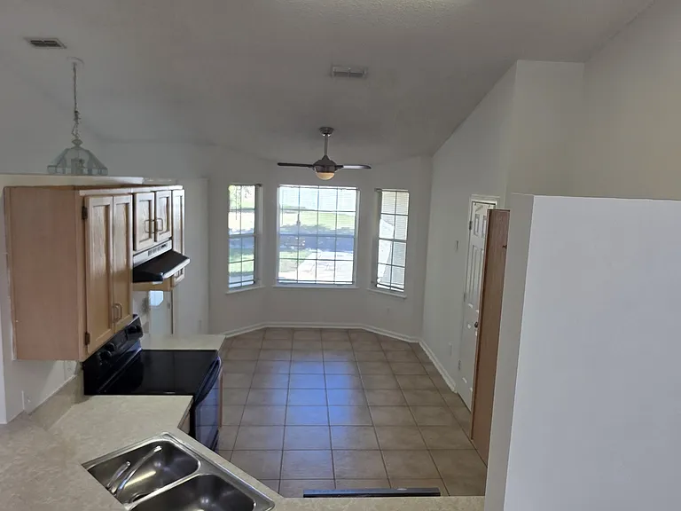 Eart in kitchen with bay window
