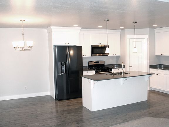 Kitchen with stainless appliances. Gas range, black stainless refrigerator. Reverse osmosis drinking water.