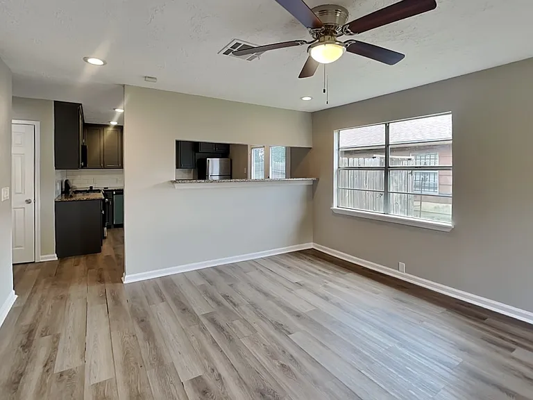 Spacious living area with neut