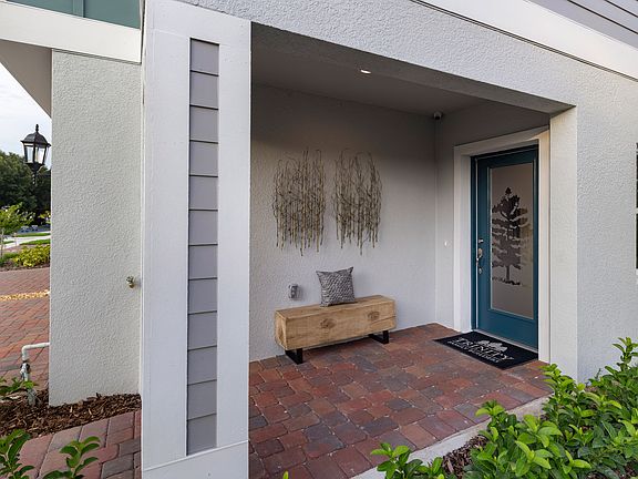 Mustang covered entry at Blue Springs Reserve by Trinity Family Builders