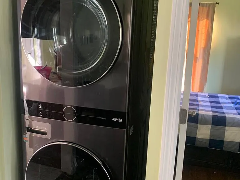 In-unit stacked washer and dryer provide convenient laundry access just steps from the bedrooms.