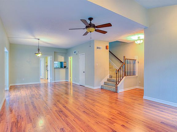 The living/dining area is open and spacious.The entry door is just out of view on the right. The half bath and storage closet are also on the right.