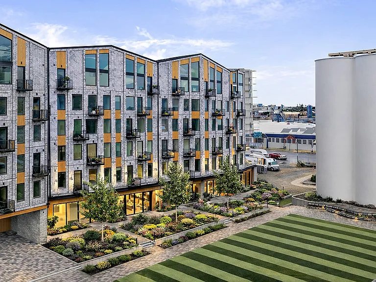 A modern residential building at Silo Park, blending contemporary design with the historic character of the Granary District.