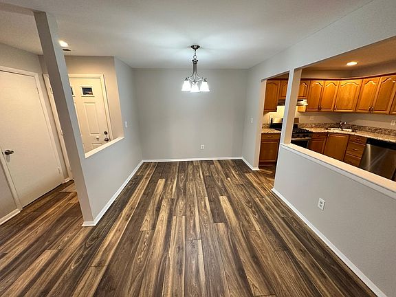 Apartment door, dining room, kitchen