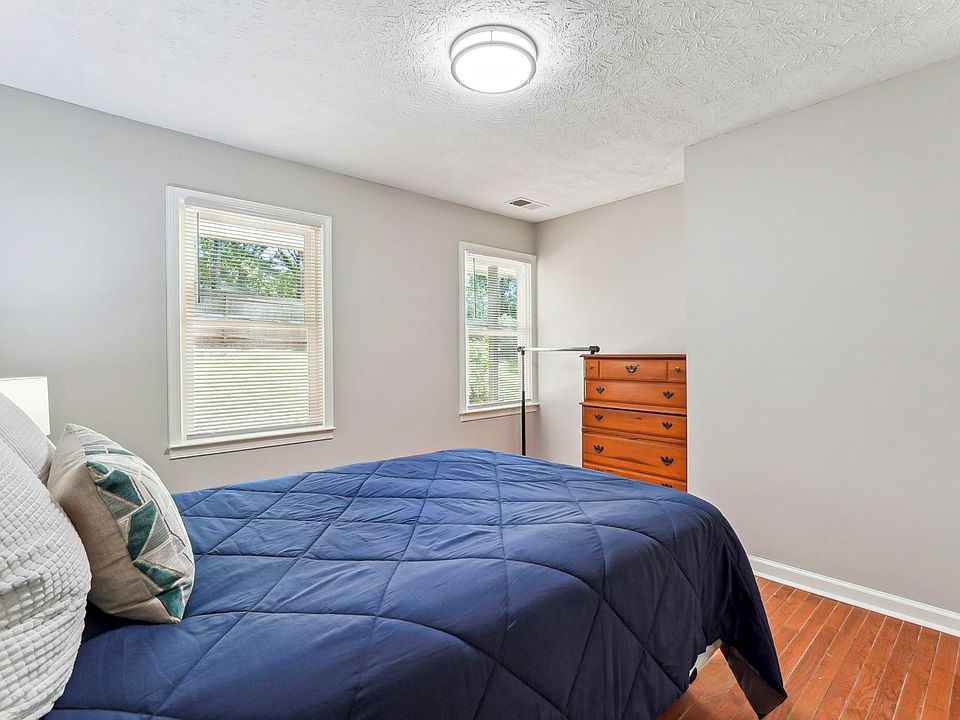 Main floor room
 with closet, dresser, full size bed.