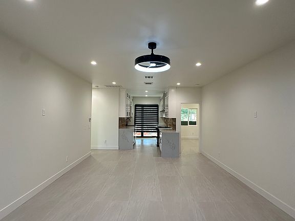 Brand new smart home with open floor plan, 9-foot ceilings, central air, and modern finishes. Large windows bring in natural light, and seamless layout from living to kitchen offers comfort and convenience for modern living.