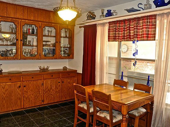 Breakfast area with built-in shelving & an amazing view of the backyard.