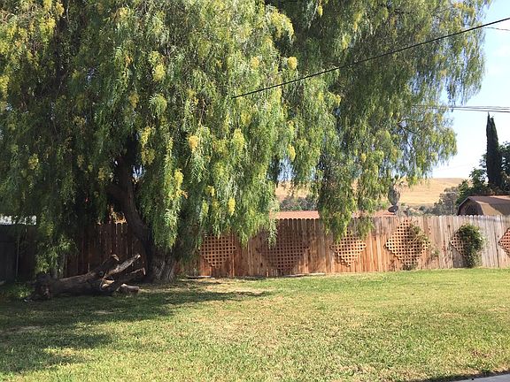 LARGE FENCED YARD WITH COVERED PATIO