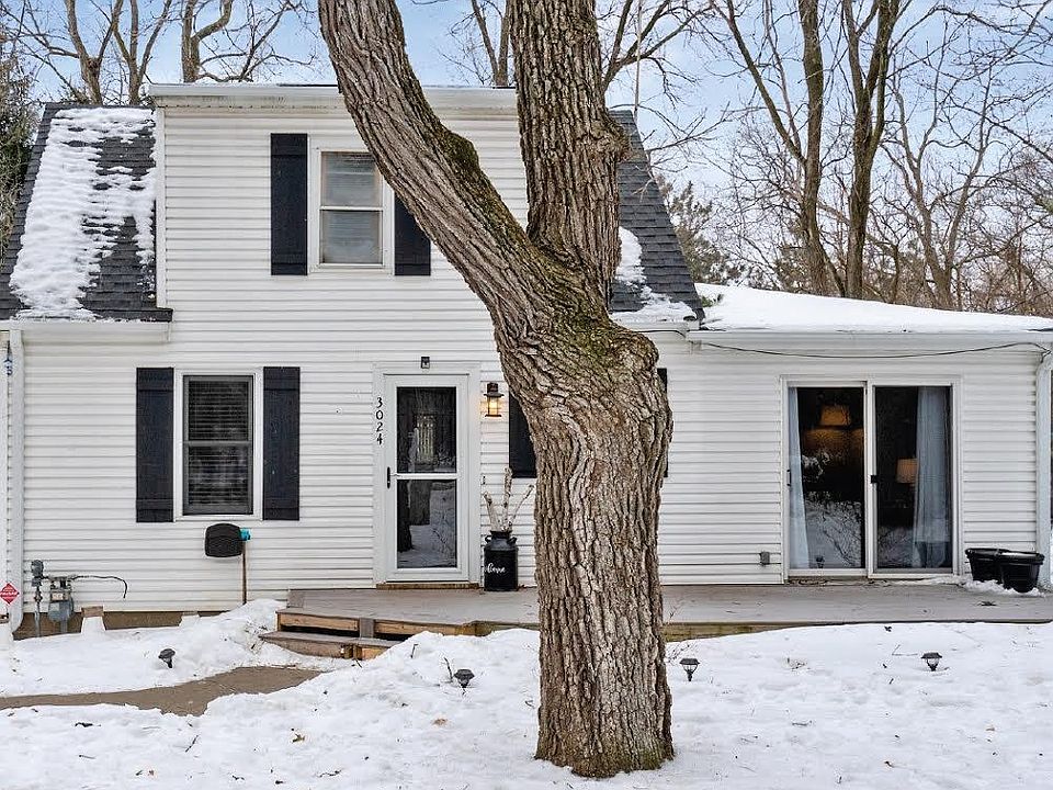 Front patio along with sliding glass door and cute yard set away from the street