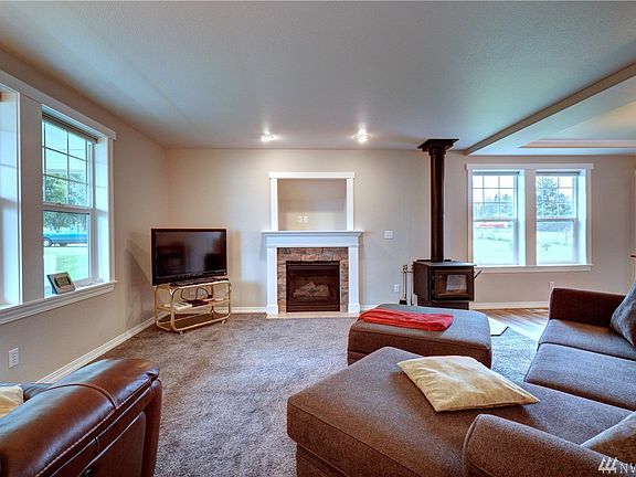 Media hook up above the fireplace is available. A second free standing stove also warms the room. 