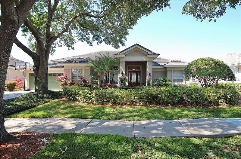 Front Exterior of this Kellogg custom built lake front home in an executive neighborhood