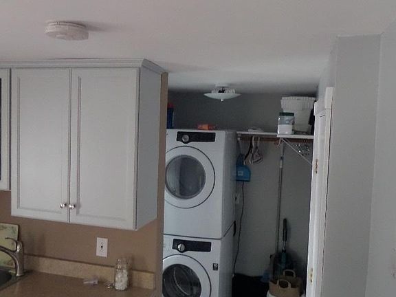 Laundry to right of kitchen on second floor. Bathroom is to left of laundry.