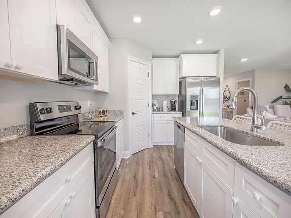 Kitchen in the Kai floorplan at a Meritage Homes community in Gulfport, MS.