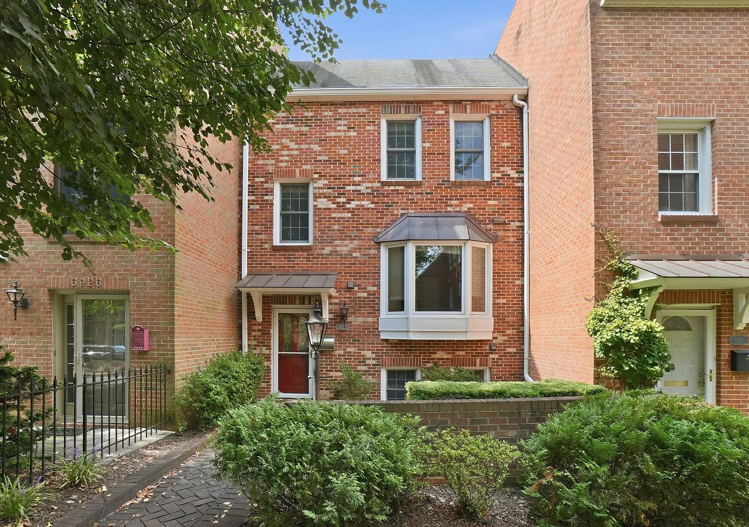 Charming four-bedroom brick townhome ideally located in the heart of McLean! T — Photo 1