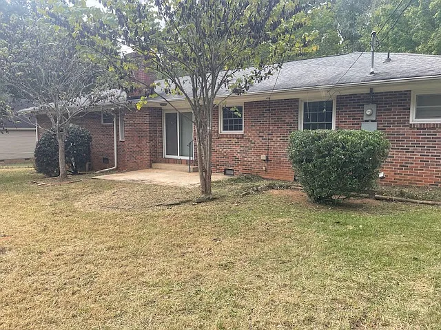 Exterior of house/backyard. Patio off of family room. - 310 Allenby Rd
