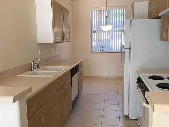 Kitchen and cozy-in-area by window.