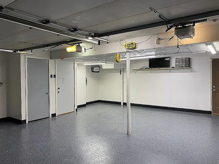 Heated garage, has been updated with work bench under the shelf