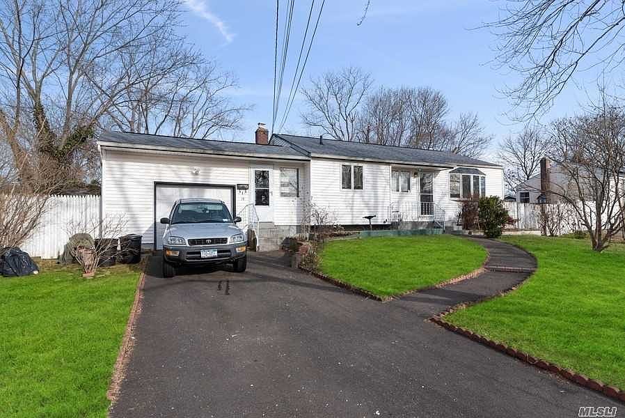 garage with long driveway