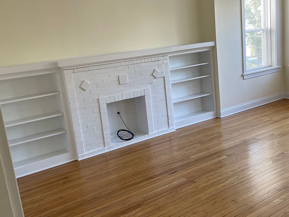 LR w/decorative fireplace from W entry of room that easily accommodate LG sectional sofa and etc... .