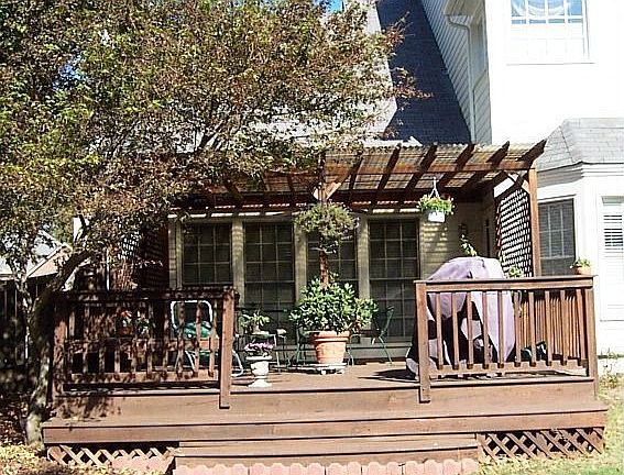 Large fenced backyard with oversized deck.  Newly landscaped.