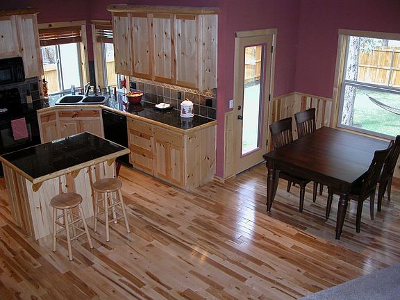 Gorgeous hardwood floors, granite, custom cabinets, doors, windows and MORE!