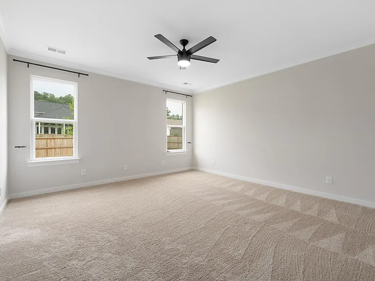 primary bedroom has been updated with wood flooring (no carpet)