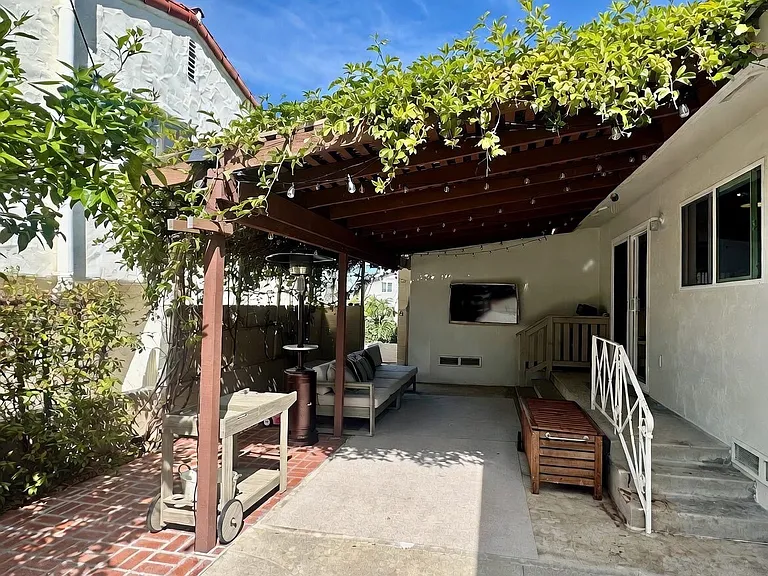 Breeze way gate that leads up to front deck