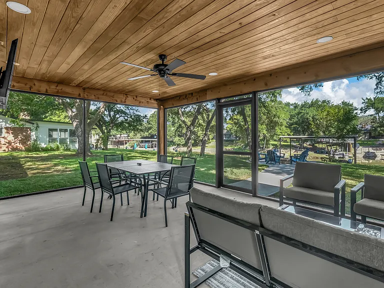 The screened in porch is a favorite of everyone's! With plenty of seating, lighting, fan and Smart TV