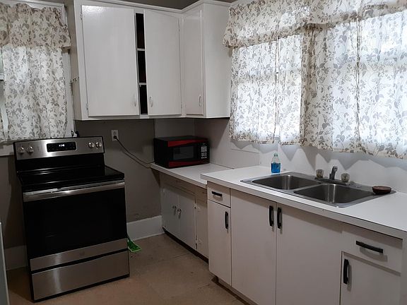 kitchen. (not shown: to right of sink is dishwasher, on left side of kitchen is refrigerator)