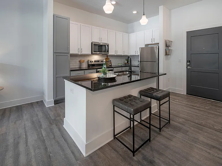 Experience modern culinary elegance with this sleek kitchen design, perfect for entertaining.