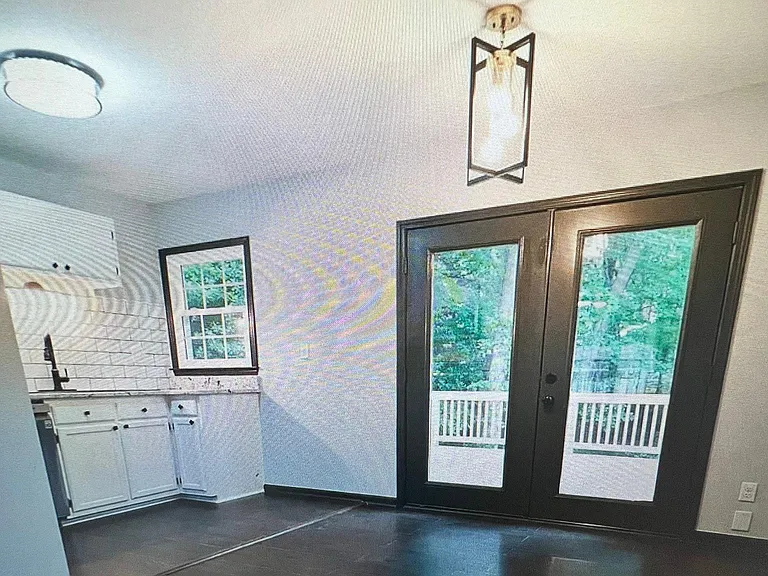 Kitchen with door to shaded deck