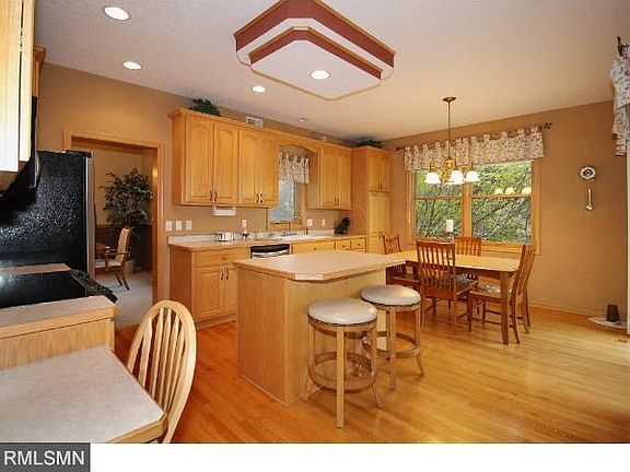 Dramatic 2-story foyer with stained glass front door and wood floors.  Main floor is all 9' ceilings