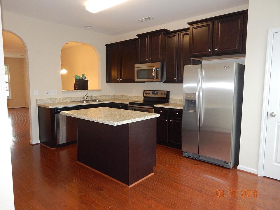 Kitchen with island and large counter space and storage.