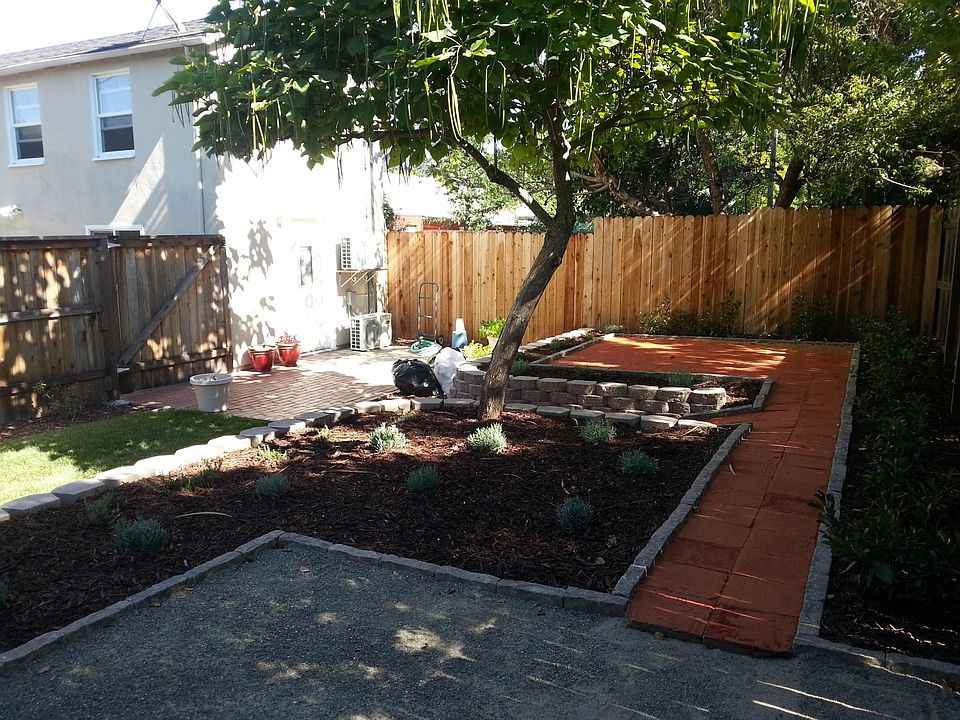 Large yard and shaded patio areas.