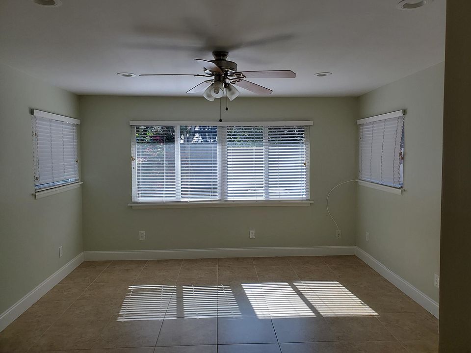 living room overlooking fenced backyard